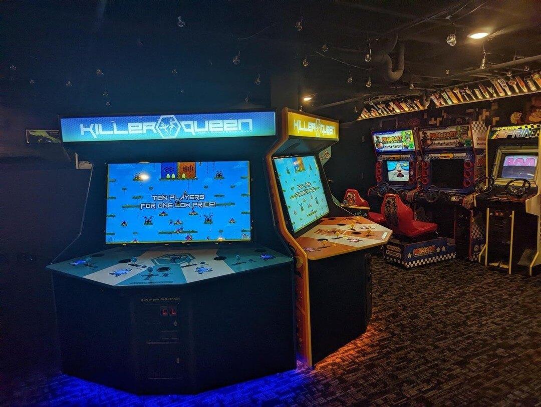 Killer Queen arcade cabinets in an arcade