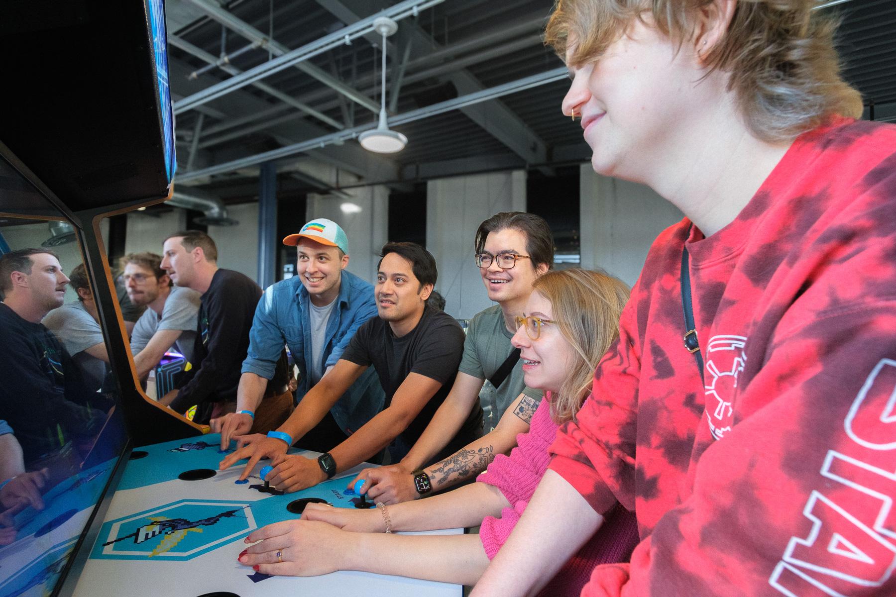 Killer Queen arcade cabinets with players